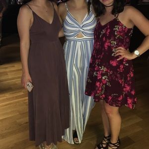 Blue and white striped jumpsuit with open/bow back